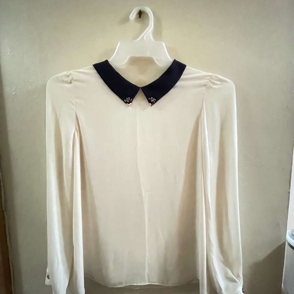 Elegant Cream Blouse with Black Collar